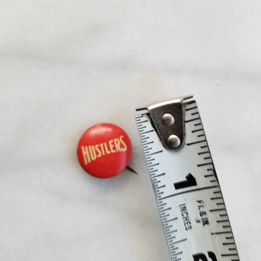 Vintage hustlers button